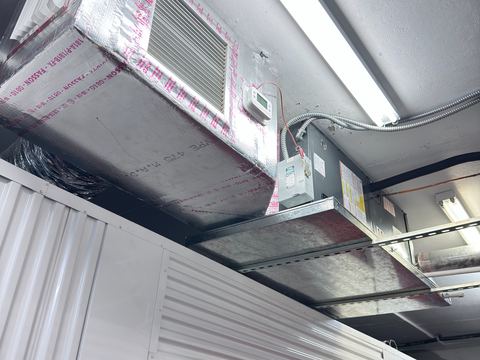Electrical contractor wiring a service panel