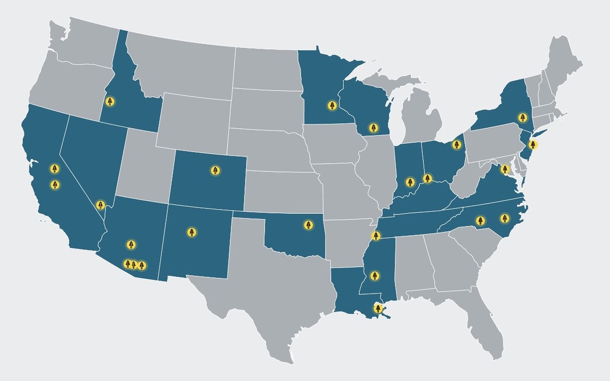 Map of Redwood Services' Partner Company footprint across the United States, with states shaded where the platform has a partner brand and tree icons marking each location